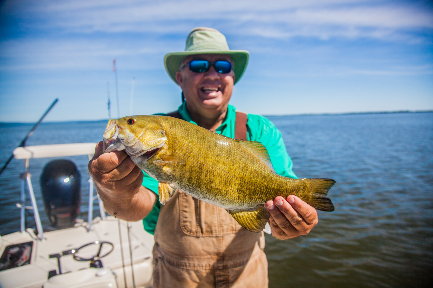 A smiling gent named Benny from Arkansas poses with a nice Chequamegon Bay smallie. According to Anglers All fishing guide Luke Kavajecz, who took Benny out on the lake, “We had to keep moving around this day to find the fish, but the action was steady and the weather was great.” (Photo courtesy of Luke Kavajecz)